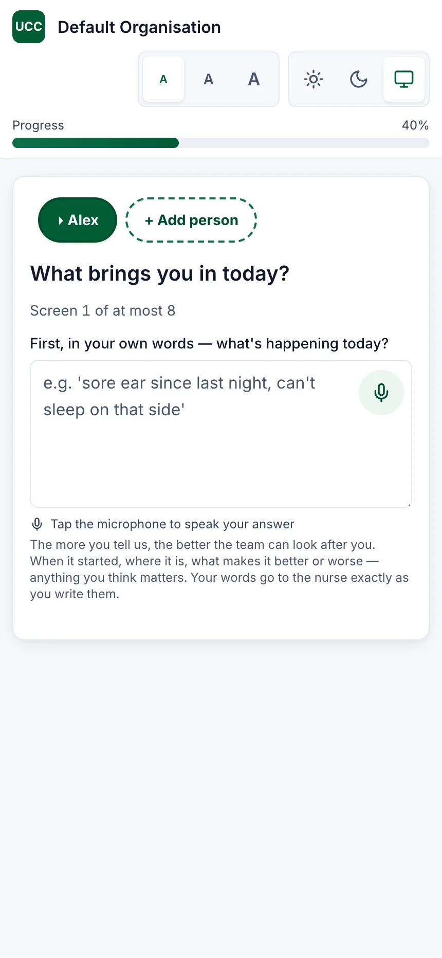 A phone screen headed “What brings you in today?”, marked “Screen 1 of at most 8”, with a large empty box asking the patient to say what is happening in their own words, a microphone button inside it, and a line underneath reading “The more you tell us, the better the team can look after you”.